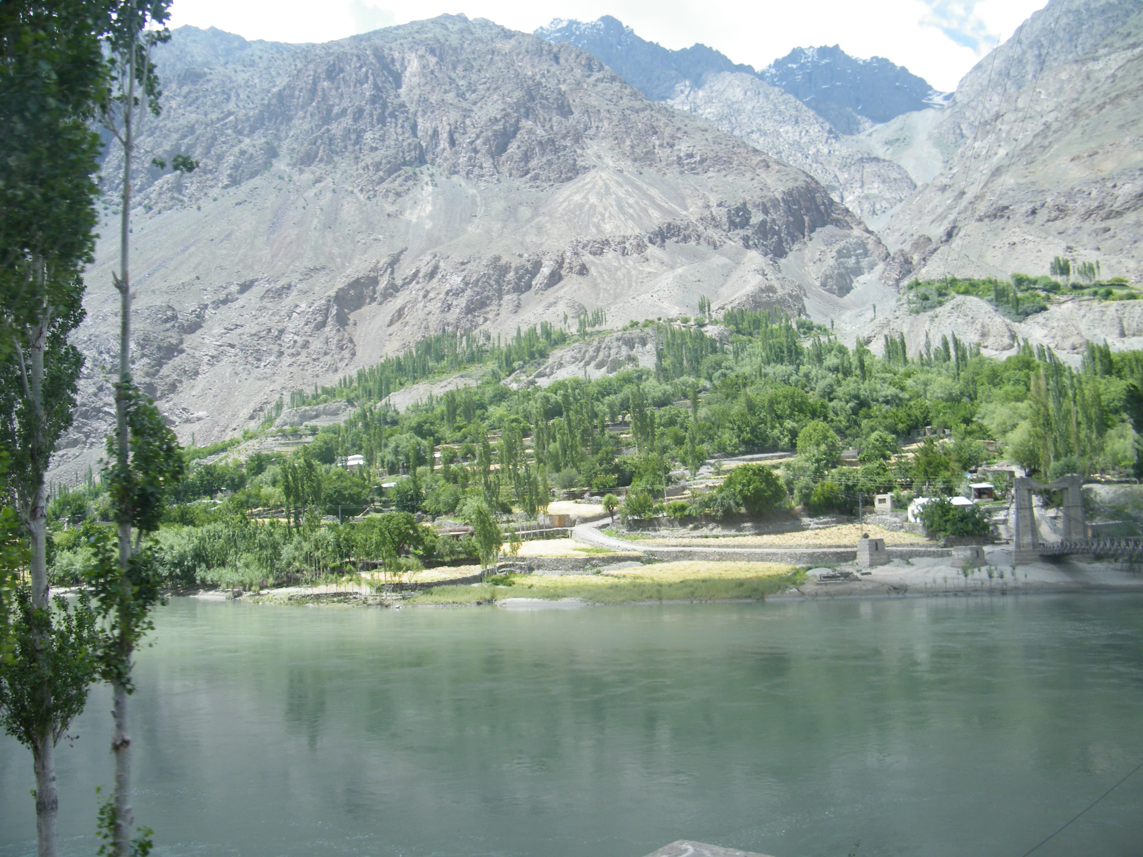 Khalti Lake's calm water beside the Gilgit-Chitral road near Gupis