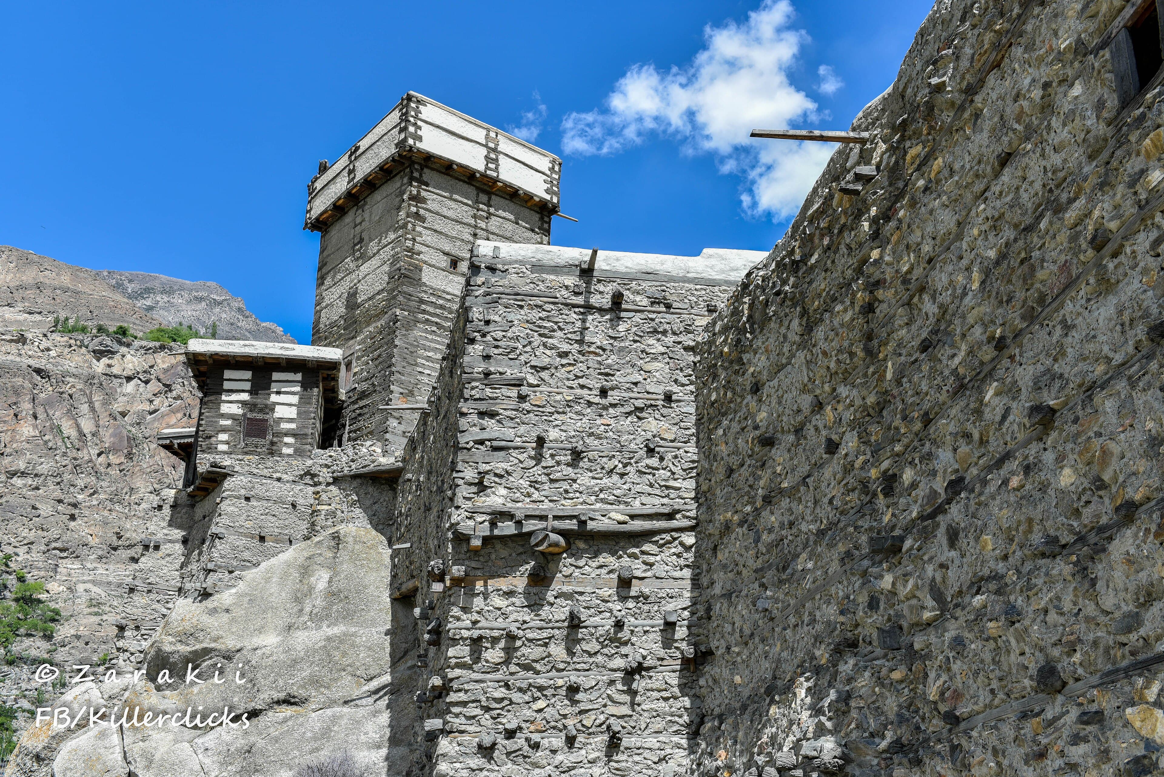 Altit Fort and its Shikari tower on a cliff above the Hunza River