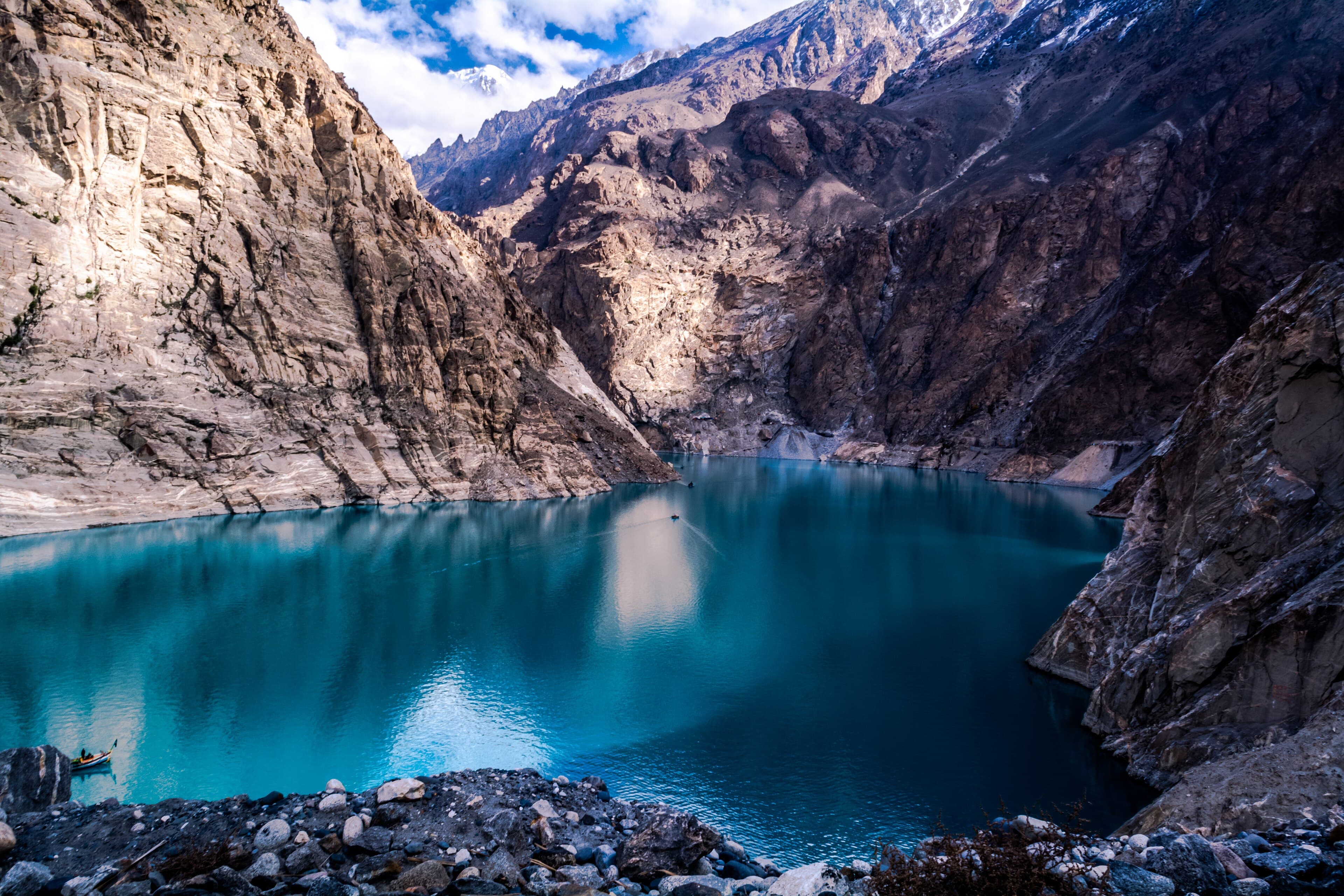 Turquoise water of Attabad Lake between Karakoram cliffs